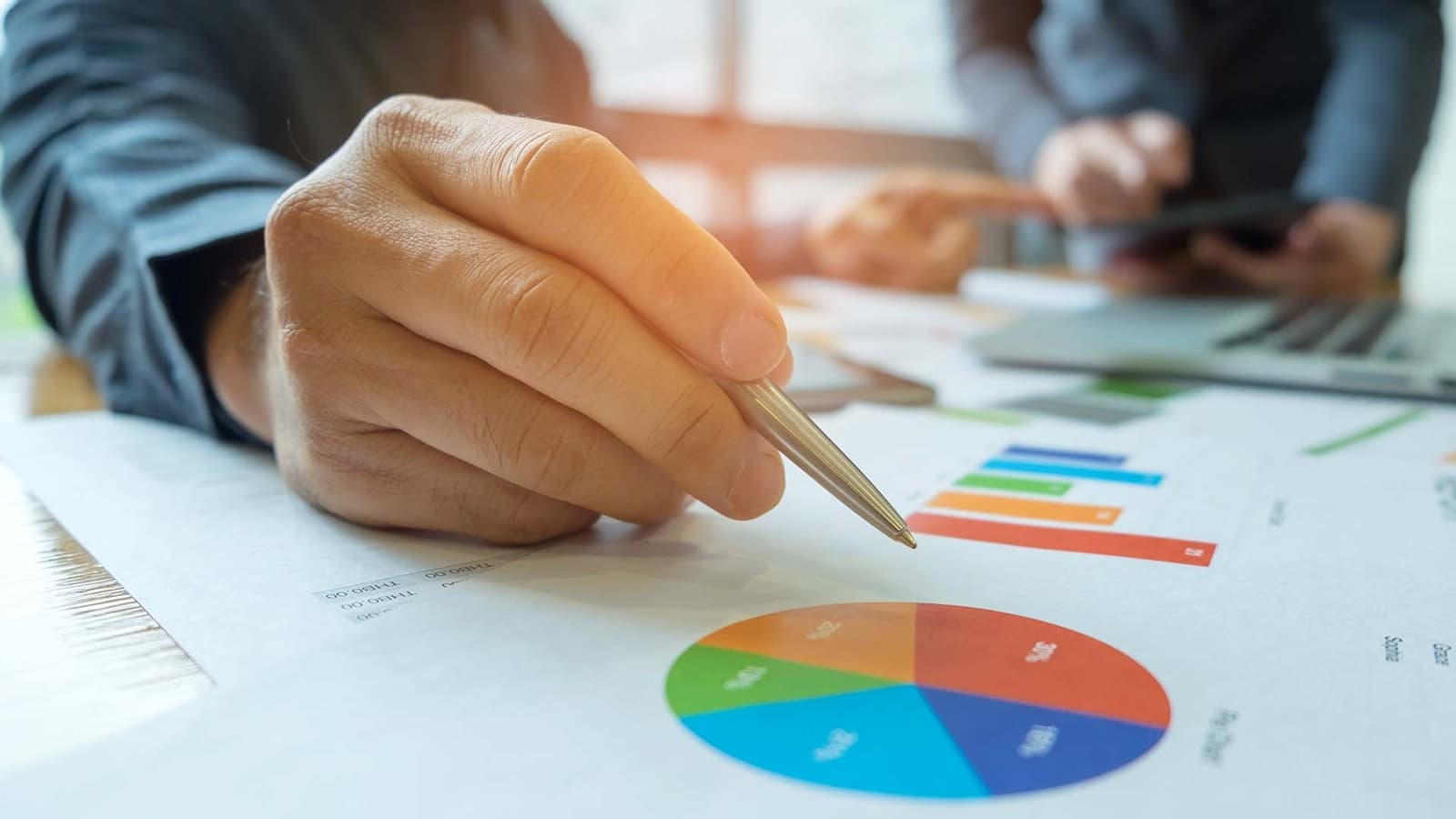 Office workers analysing graph data